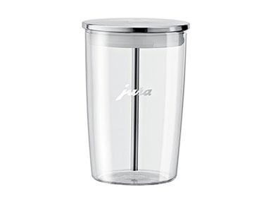 Un recipiente de plástico transparente Jura con un agitador de metal y una tapa.
