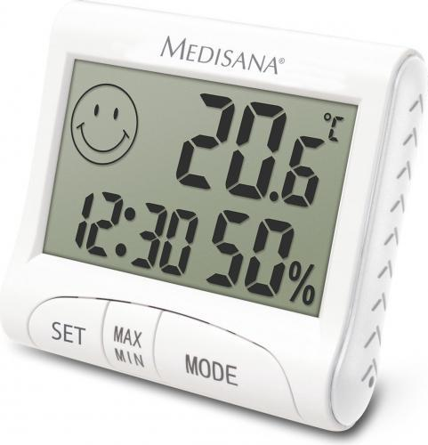 Termómetro digital blanco. Muestra la hora, la temperatura y la humedad. Cara sonriente en la pantalla.