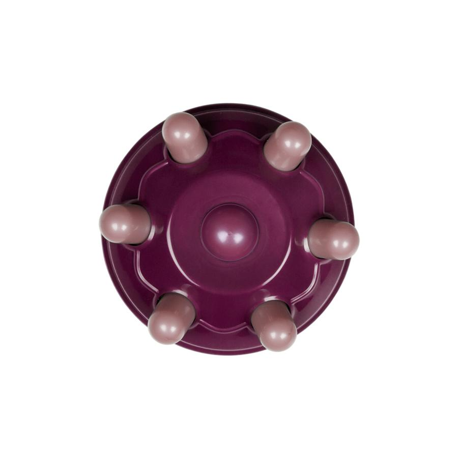 Un dispositivo morado con siete pequeños cilindros alrededor del centro.