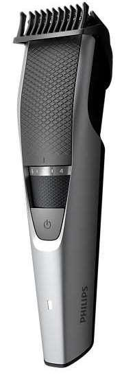 Afeitadora Philips plateada y negra. Tiene un accesorio de peine y un botón de encendido.