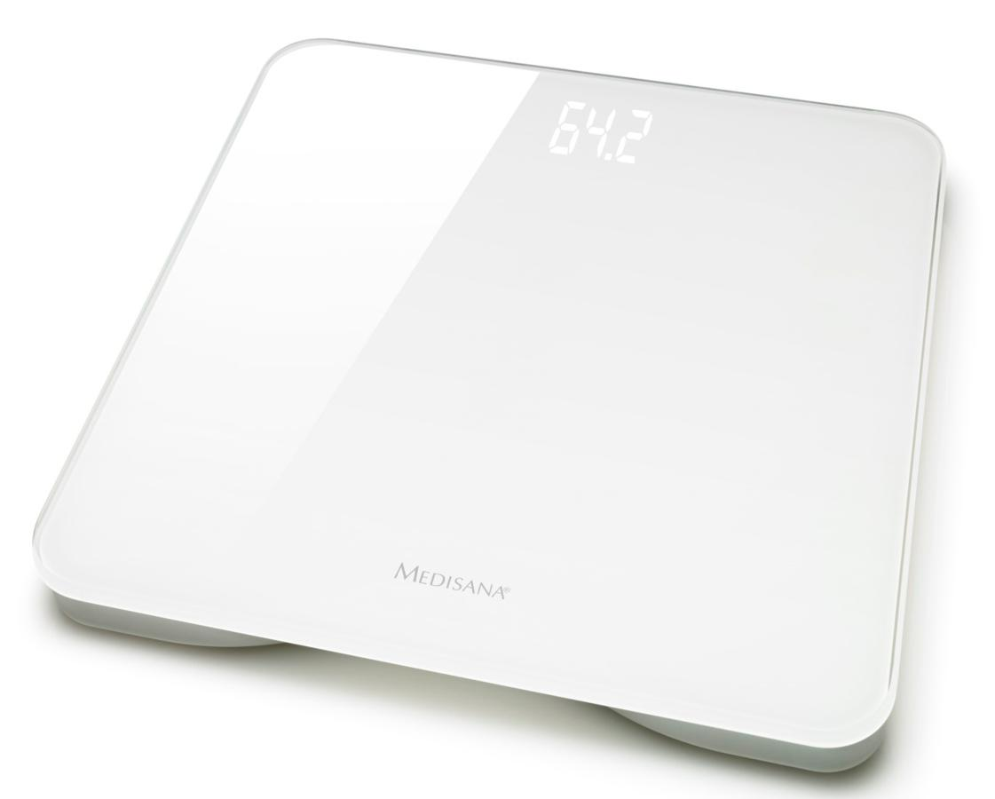 Una báscula digital blanca con pantalla clara que muestra '64.2'. Marca 'MEDISANA' visible.