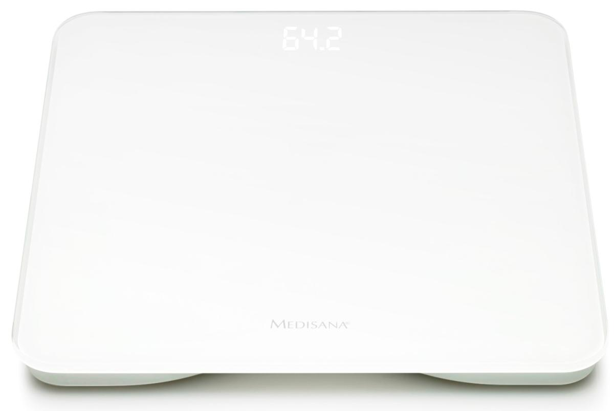 Báscula digital blanca con pantalla que muestra 64.2. La báscula tiene un diseño simple.