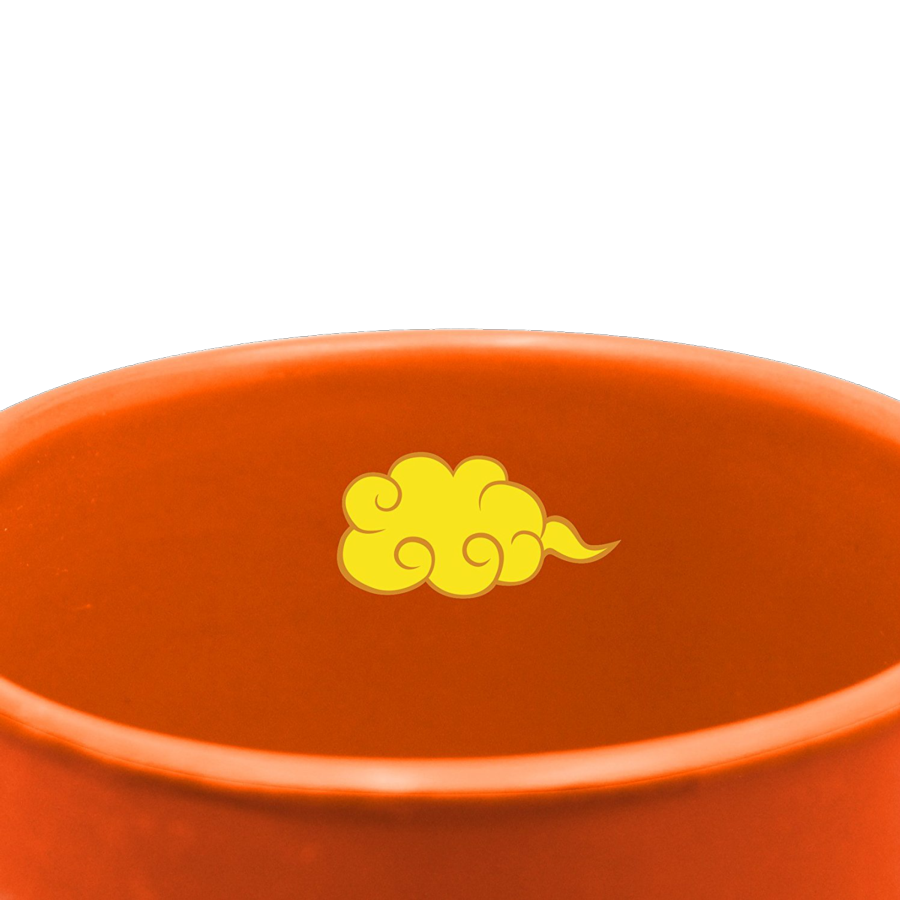 Cuenco naranja con un diseño de nube amarilla.