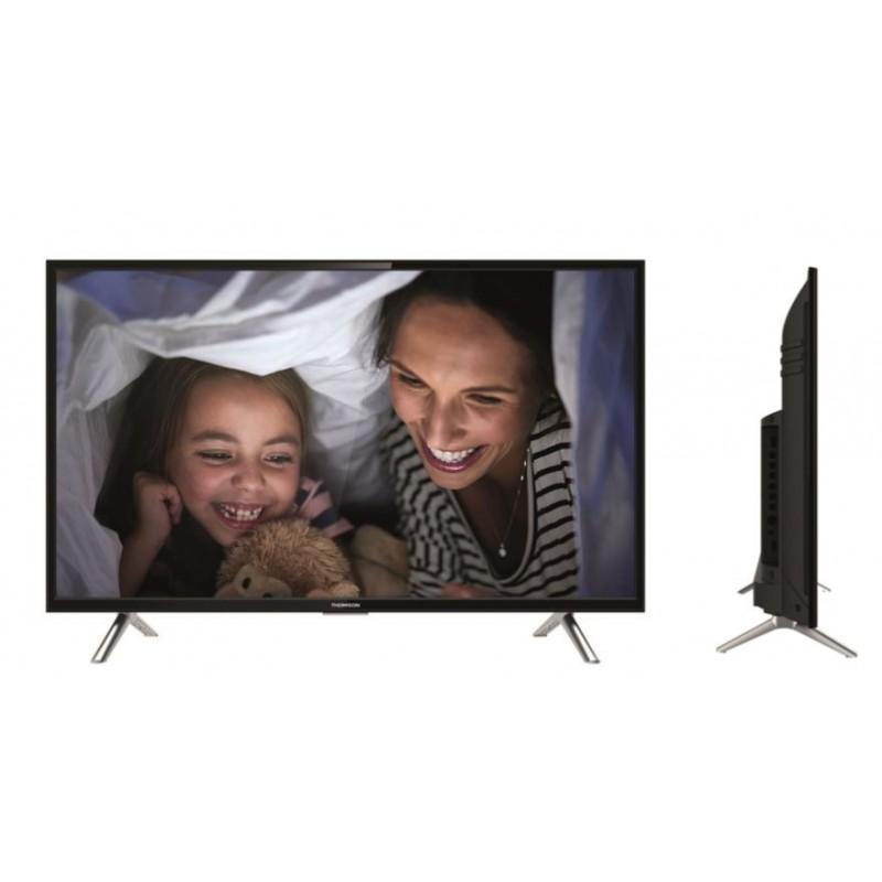 Una pantalla de TV muestra a una mujer y una niña sonriendo bajo una manta. Una vista lateral muestra el televisor sobre patas plateadas.