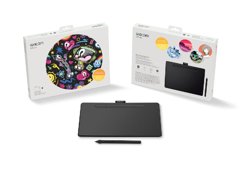 Tableta Wacom Intuos con embalaje. La tableta es negra con un lápiz. Las cajas muestran ilustraciones e info.
