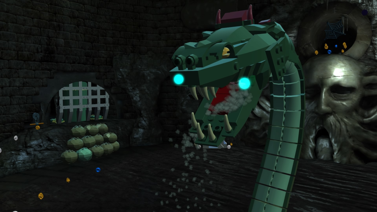Eine Lego-Szene mit einem grünen Schlangenkopf. In einer Höhle befinden sich Lego-Objekte.