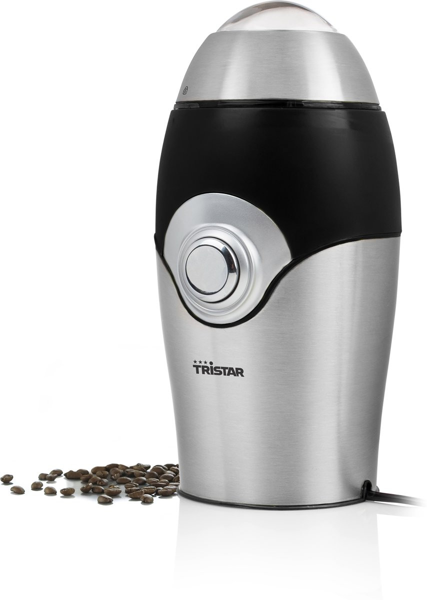 Koffiemolen met koffiebonen ernaast.
