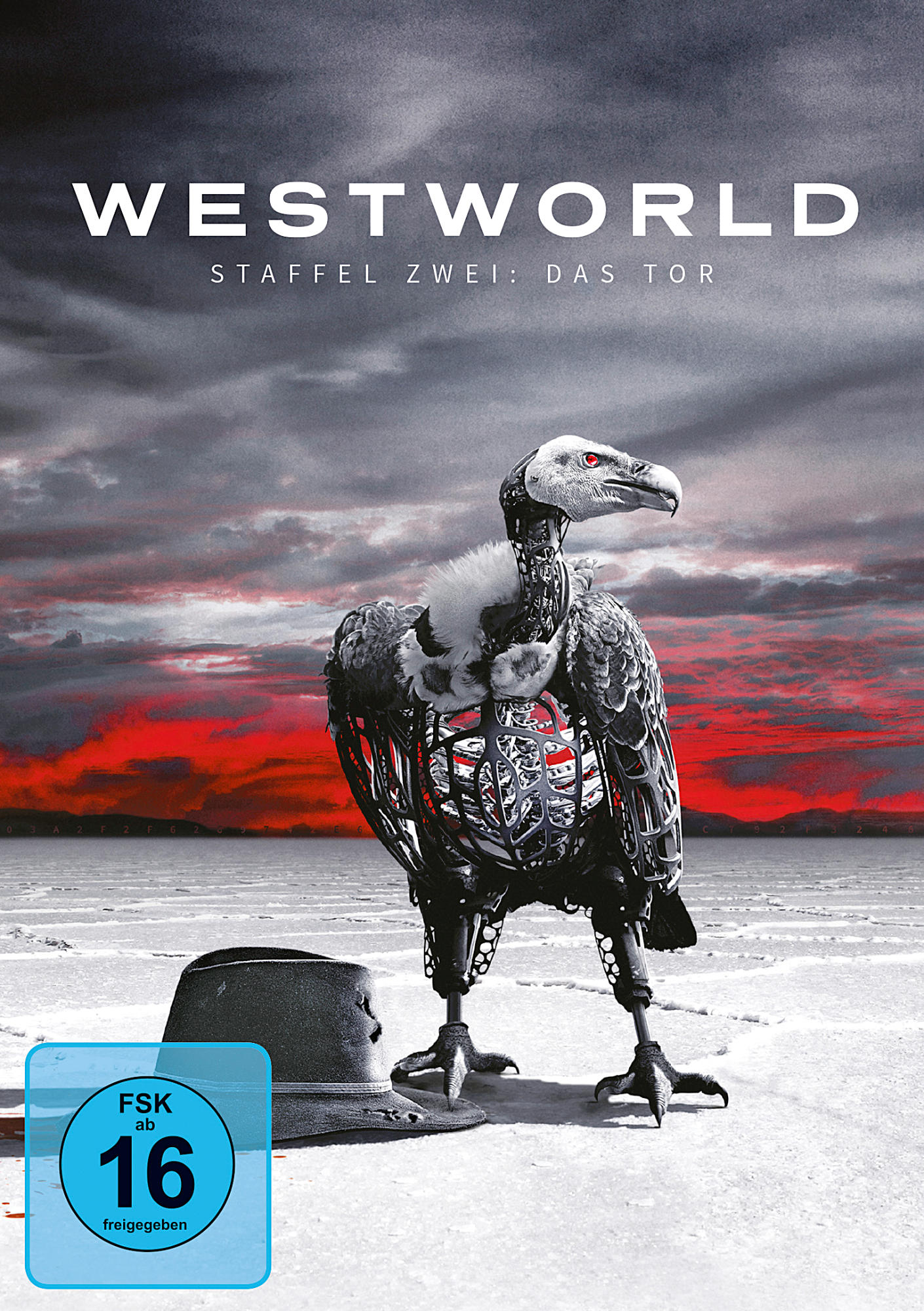 DVD-Cover: Ein geierartiger Roboter steht auf einer weißen Oberfläche, mit Hut und rotem Himmel.
