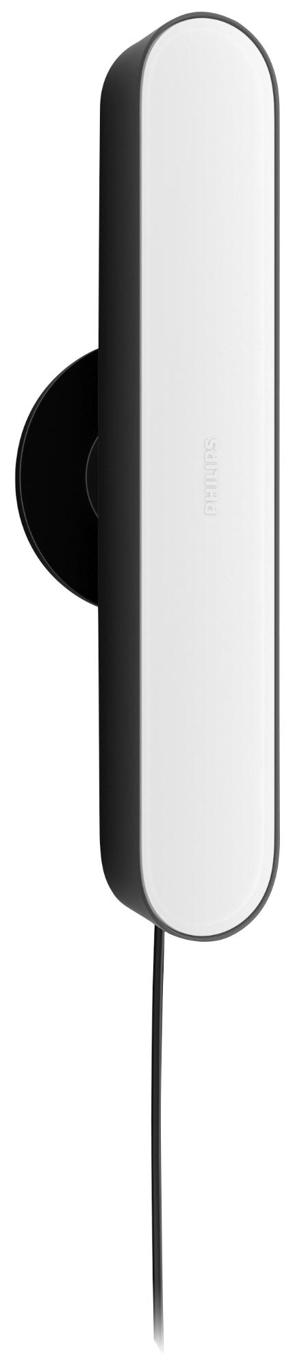 Una lampada da parete bianca e nera con cavo nero.