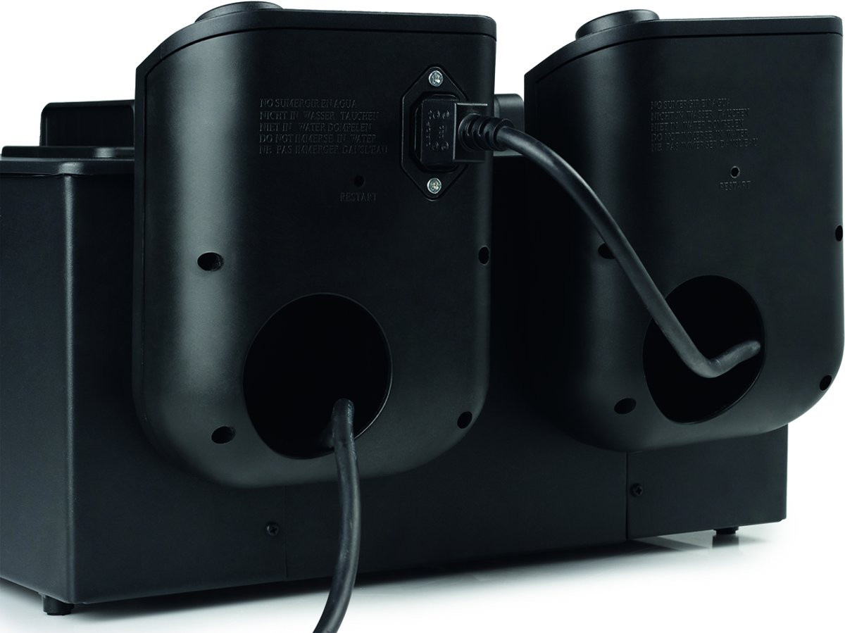 Back view of two black devices connected by a black cable. Text and a power port visible.
