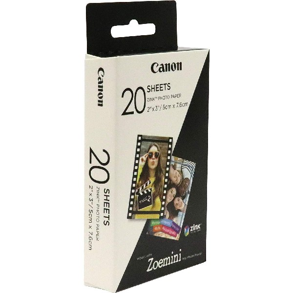 Caja de papel fotográfico Canon ZINK. Tiene imágenes de fotos y texto. El fondo es blanco.