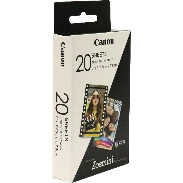 Caja de papel fotográfico Canon con fotos de personas y el nombre de la marca.