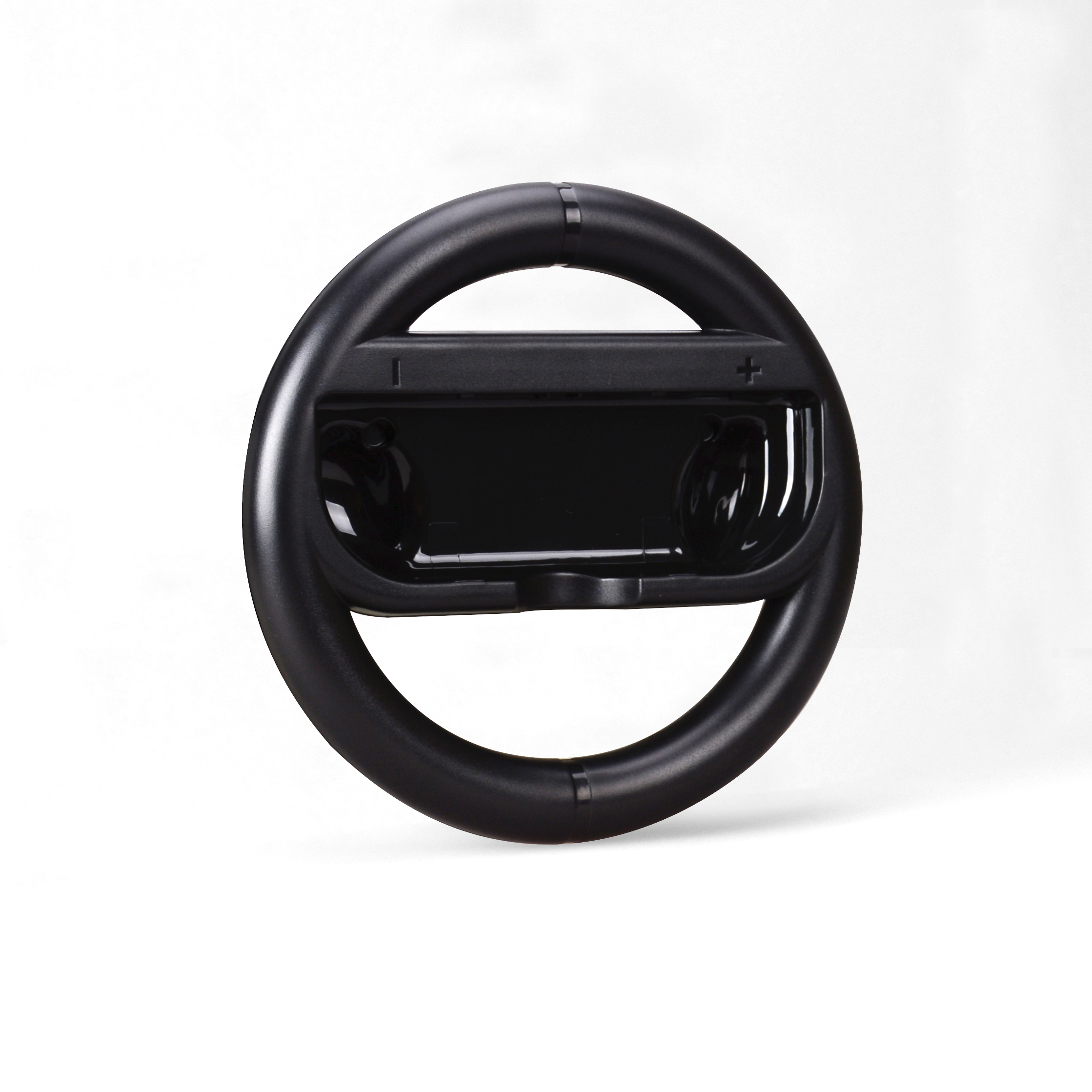 Ein schwarzer, lenkradförmiger Controller für eine Spielekonsole. Es hat Tasten.