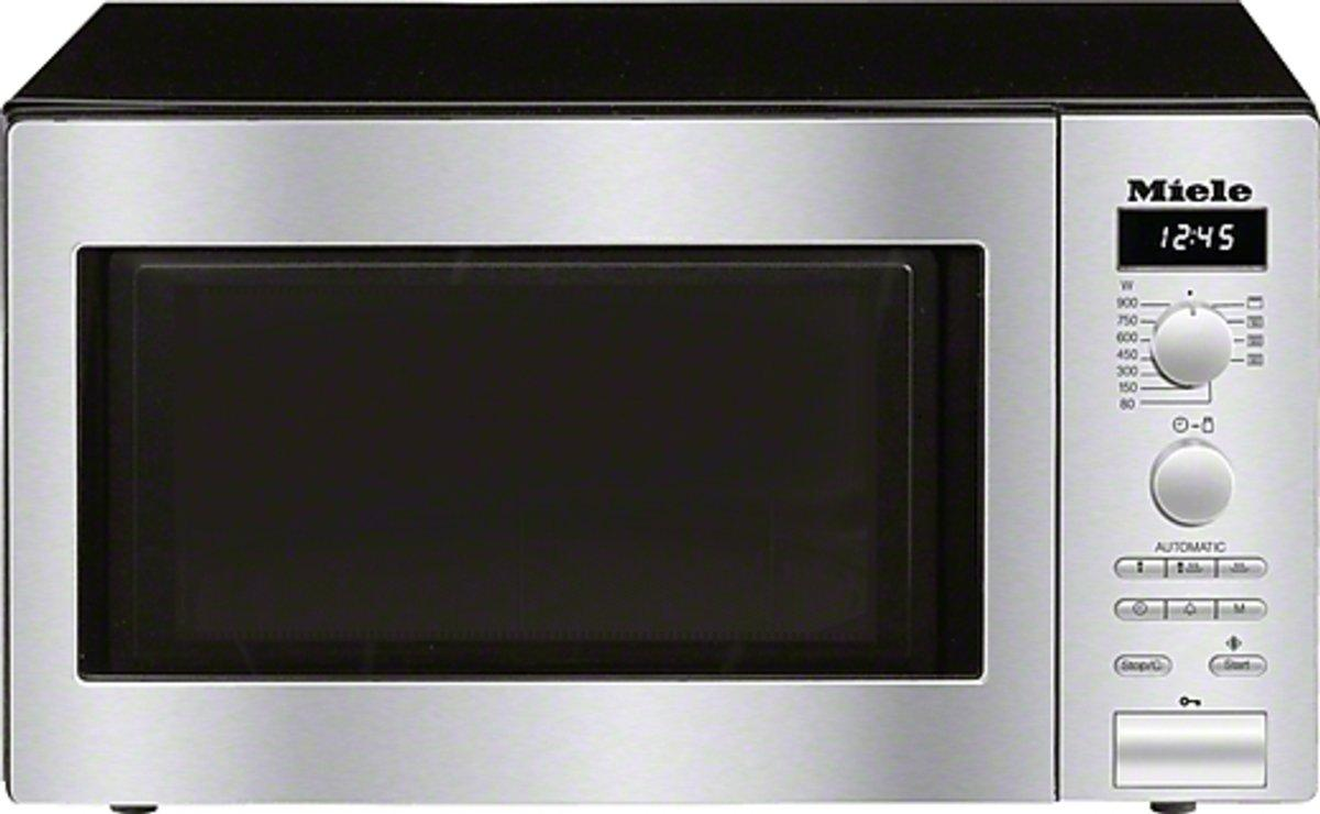 Horno microondas plateado con pantalla digital, botones y dial para ajustes de potencia.