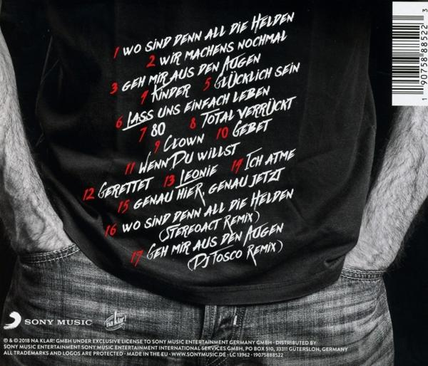 Rückseite eines schwarzen T-Shirts mit Songtext. Worte in Rot und Weiß. Denim-Jeans-Hintergrund.