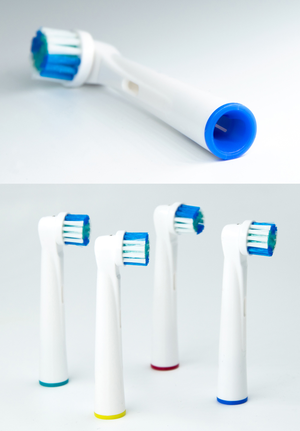 Têtes de brosse à dents électrique. Une avec des poils bleus, d'autres avec des bases de couleurs variées.