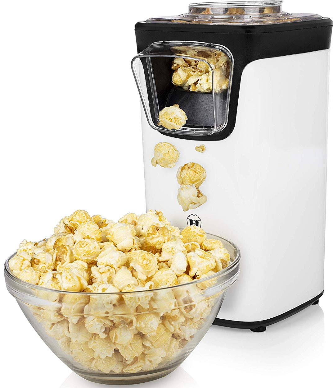 Macchina per popcorn bianca e nera con popcorn in una ciotola e popcorn che cadono.