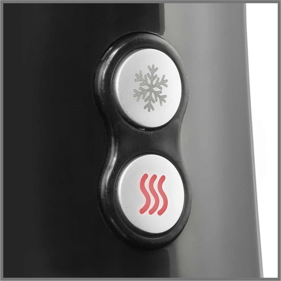 Nahaufnahme von zwei Knöpfen. Einer für Schneeflocke, der andere für Heizsymbole.