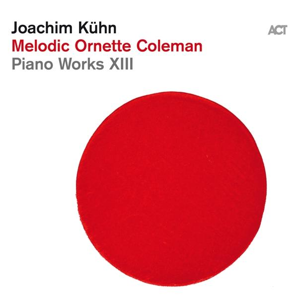 Albumcover mit Text und großem roten Kreis auf weißem Hintergrund. Künstler und Titel sind vorhanden.