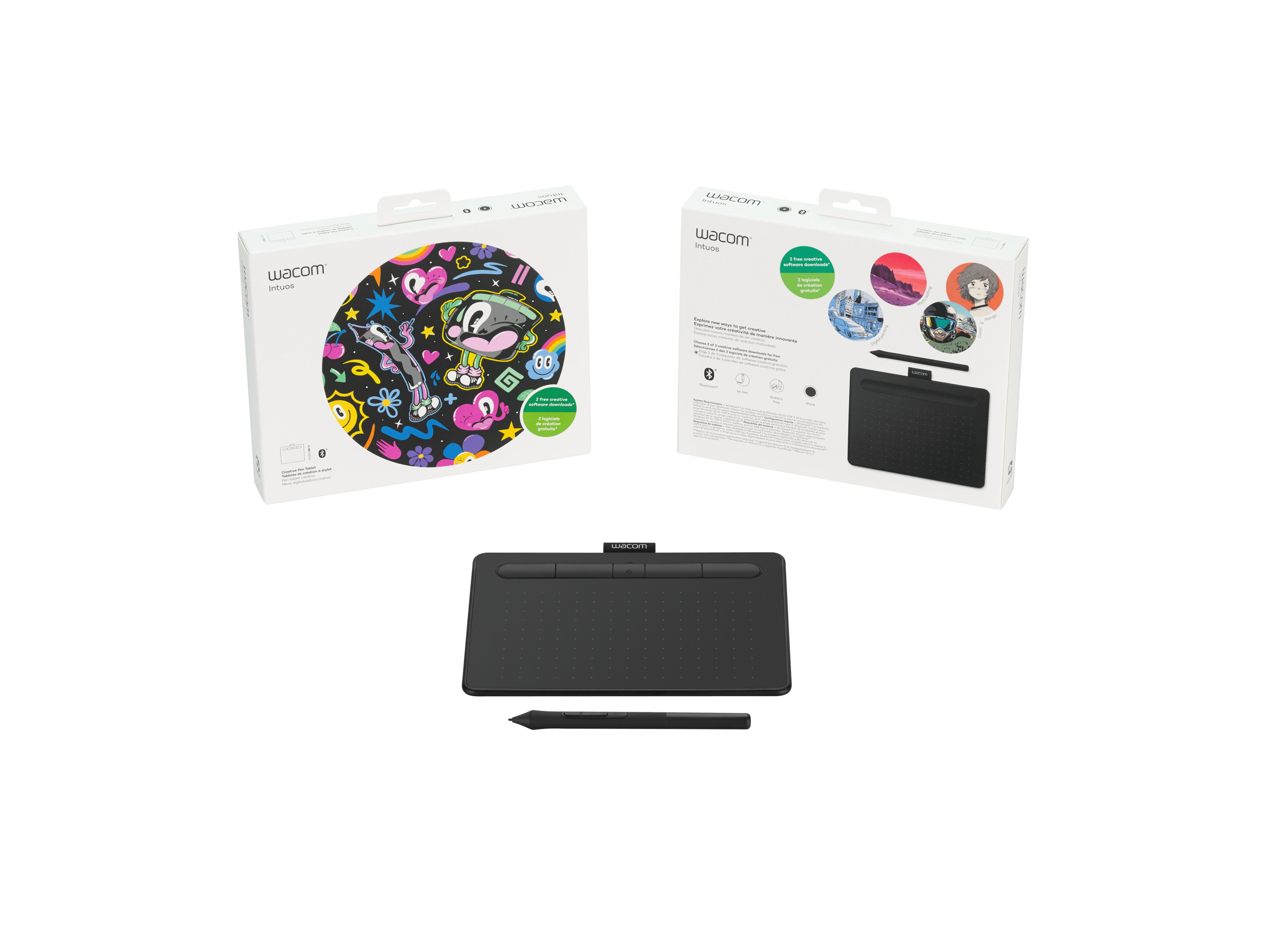 Ein schwarzes Zeichentablett, ein Stift und zwei Kartons. Eine Box zeigt bunte Illustrationen.