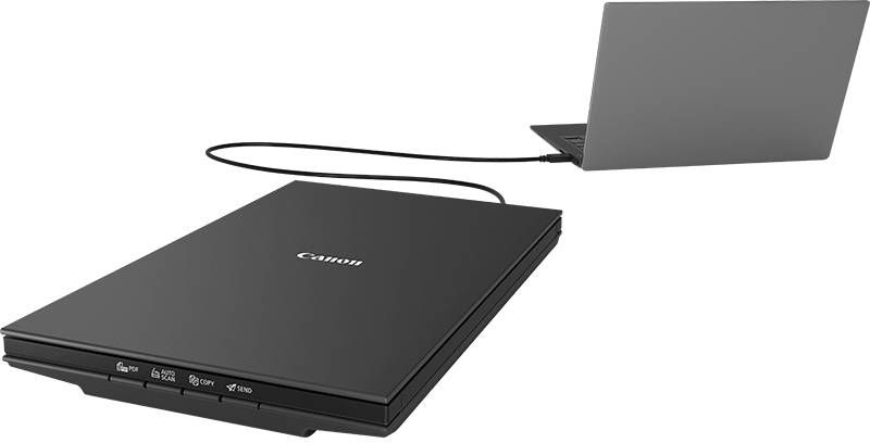 Black Canon scanner connected to a laptop via a USB cable.