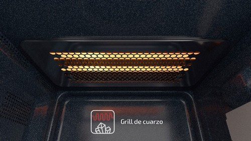 Interior de un horno microondas con la parrilla encendida. La parrilla está encendida en naranja.
