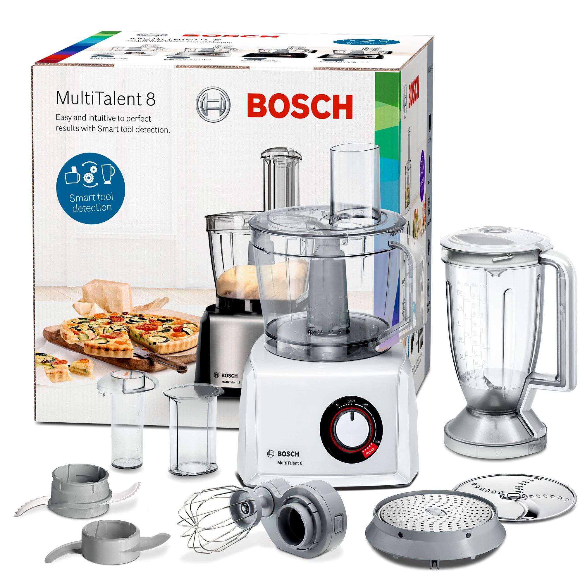 A white Bosch food processor with multiple attachments and a blender, displayed with a box.