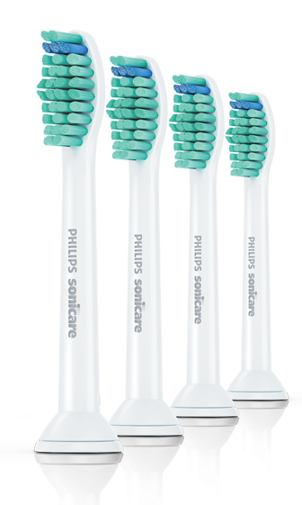 Vier weiße Philips Sonicare Zahnbürstenköpfe mit grünen und blauen Borsten.