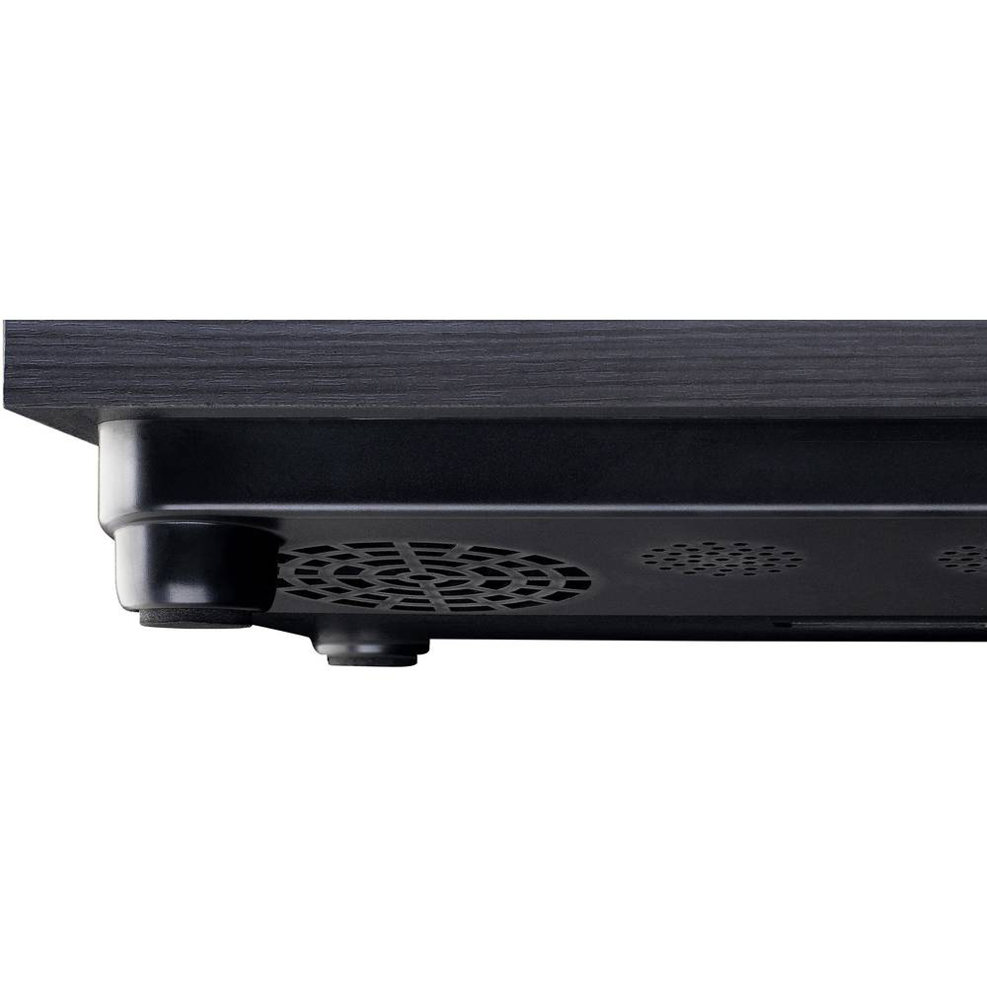 Black, flat computer stand with ventilation holes on the bottom. Wood-like texture.