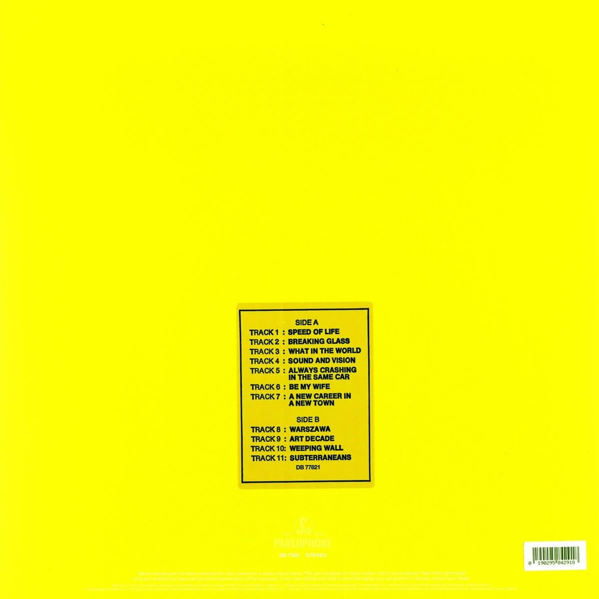 Pochette de disque jaune avec listes de titres dans une boîte. Texte : Face A et Face B. Texte blanc sur jaune.