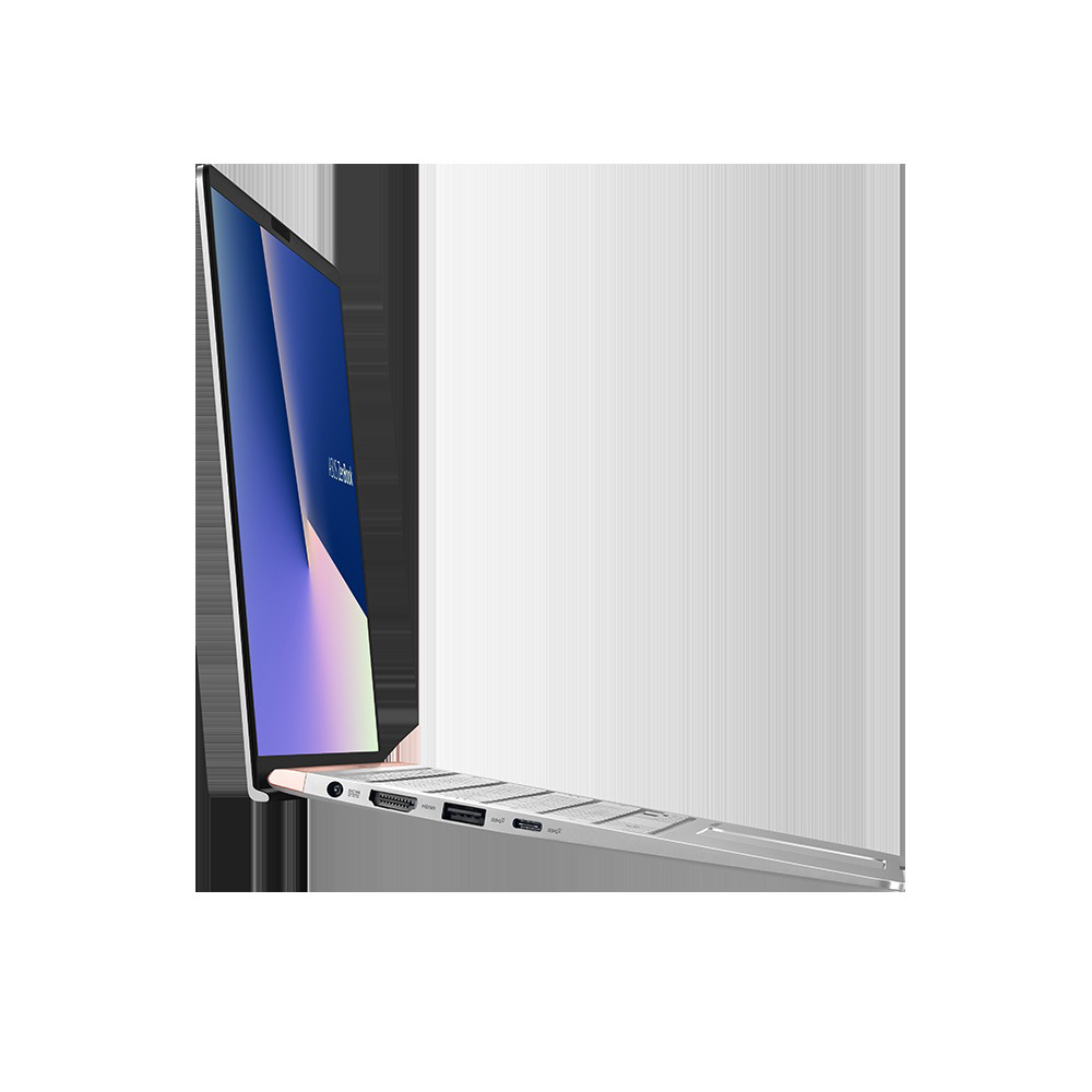 Seitenansicht eines silbernen Laptops mit beleuchtetem blauen Bildschirm auf hellem Hintergrund.