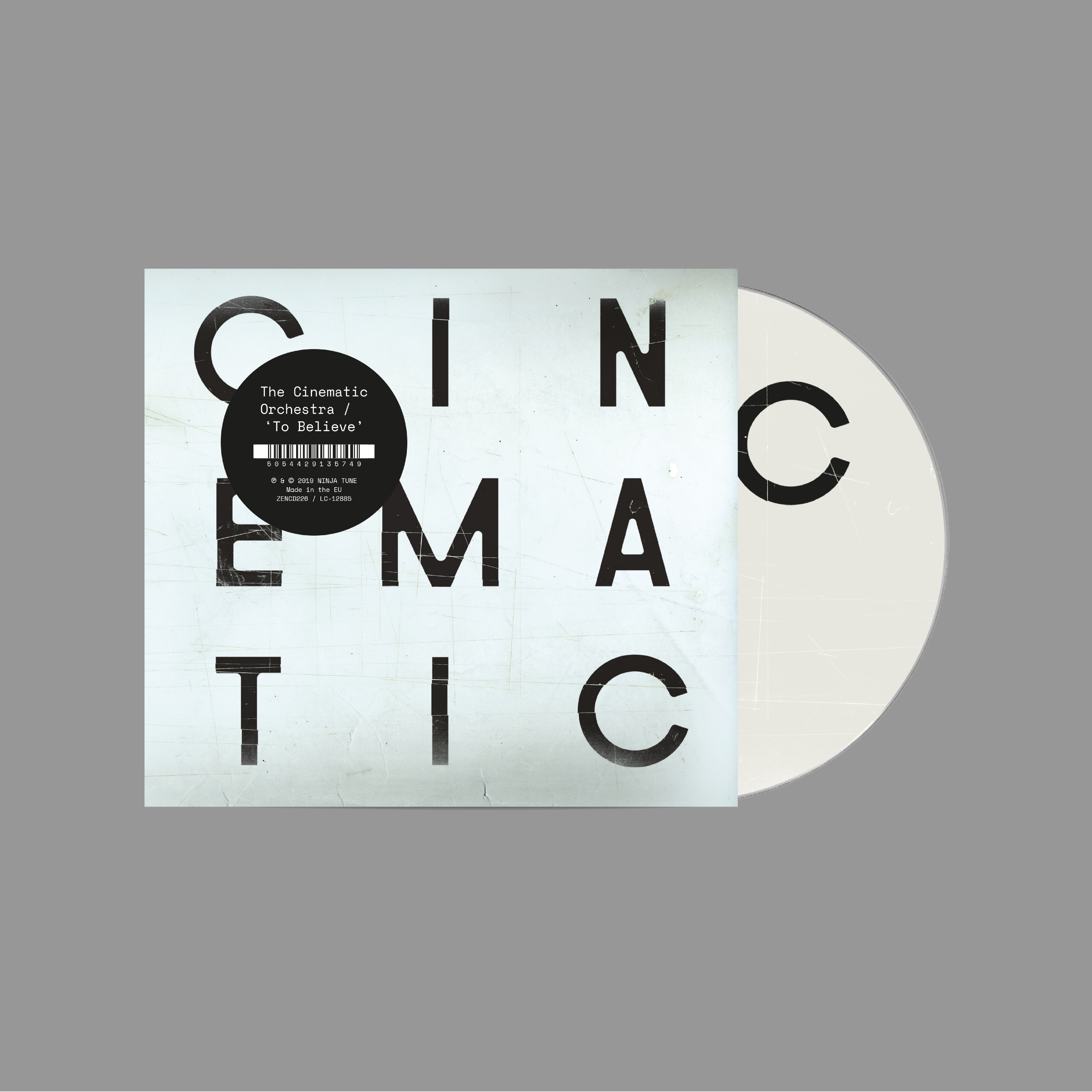 CD-Hülle mit dem Wort 'CINEMATIC' in großen schwarzen Buchstaben. Daneben eine CD.