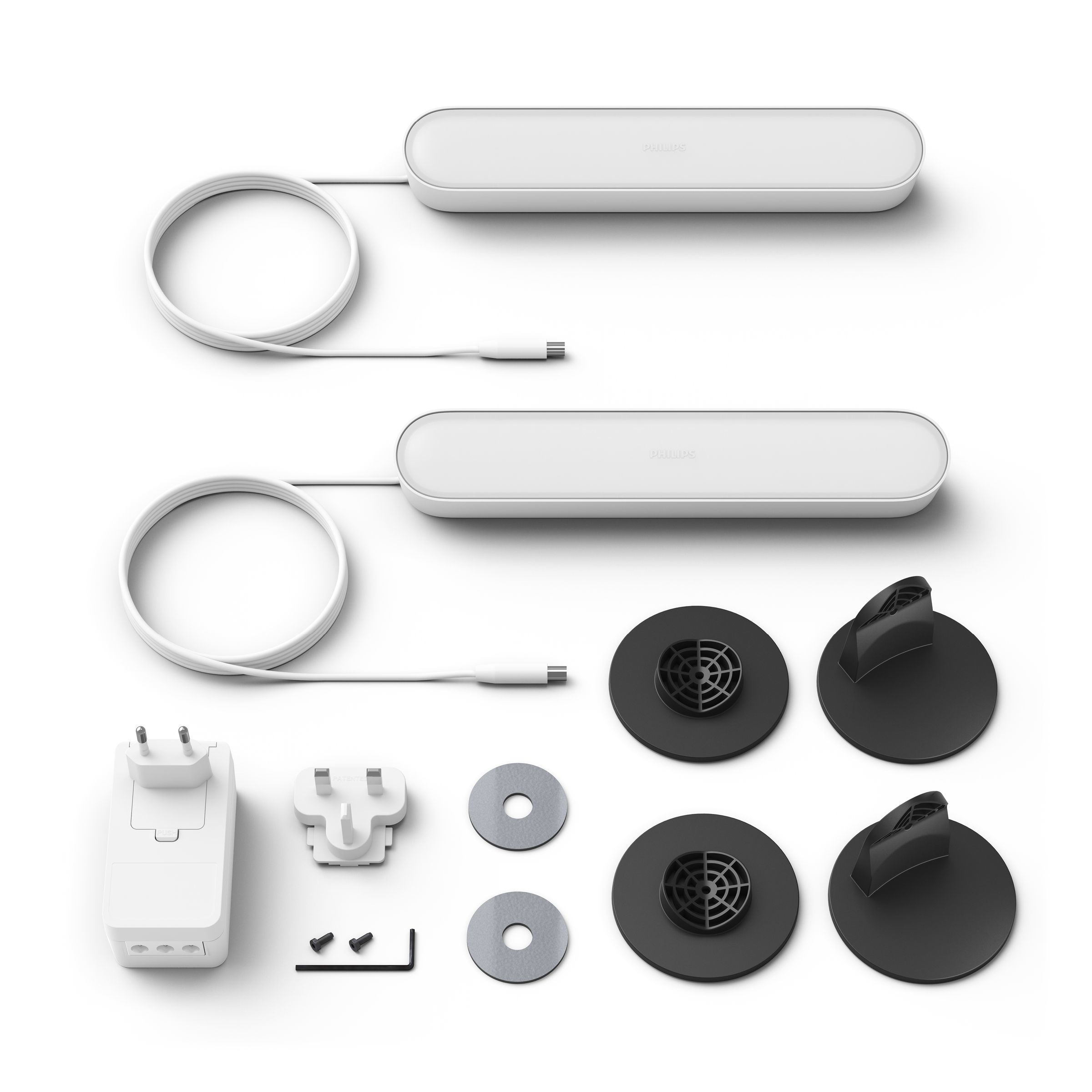 Two white light strips, power adapter, and other accessories are on a white surface.