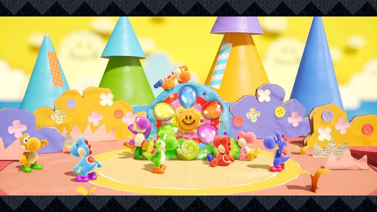 Personaggi Yoshi colorati in una scena diorama. Lo sfondo è un mondo di carta dai colori vivaci.