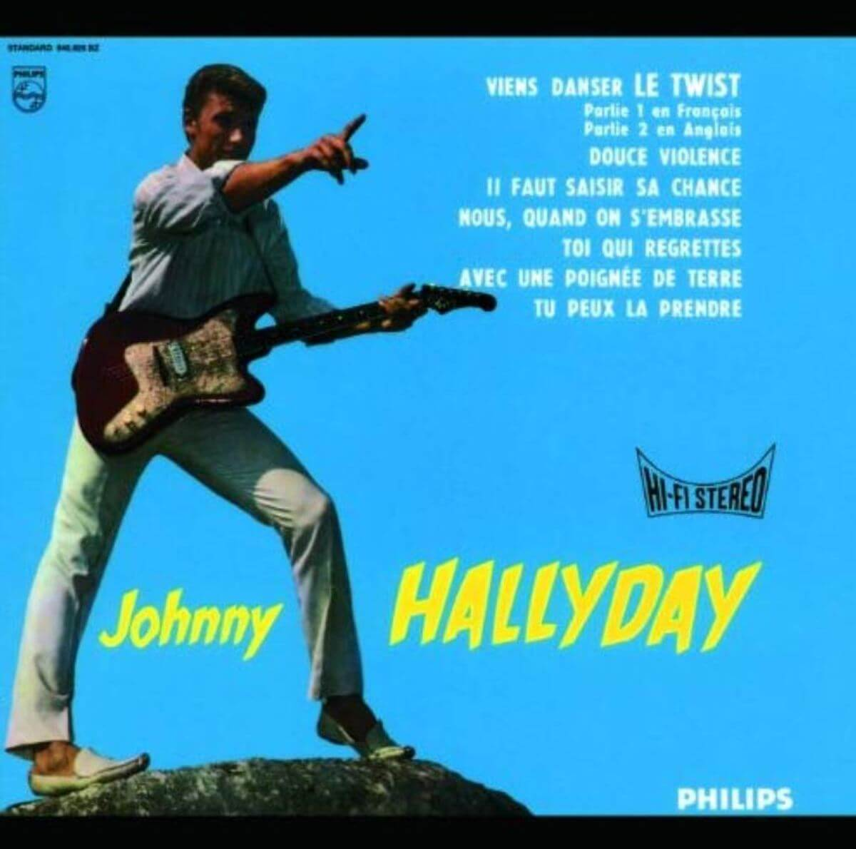 Johnny Hallyday album cover with a man playing guitar on stage.