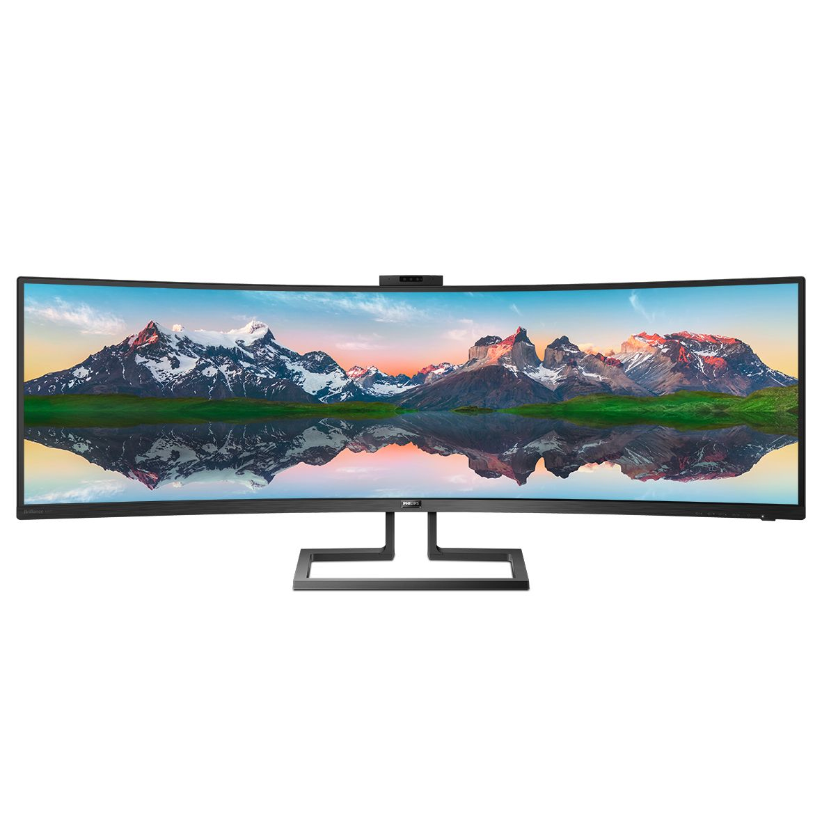 Ein ultra-breiter, gebogener Monitor mit einer Berglandschaft, die sich im Wasser spiegelt.