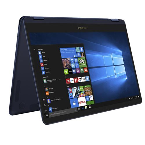 Una computadora portátil azul oscuro está abierta, la pantalla muestra la interfaz de Windows. Inclinada.