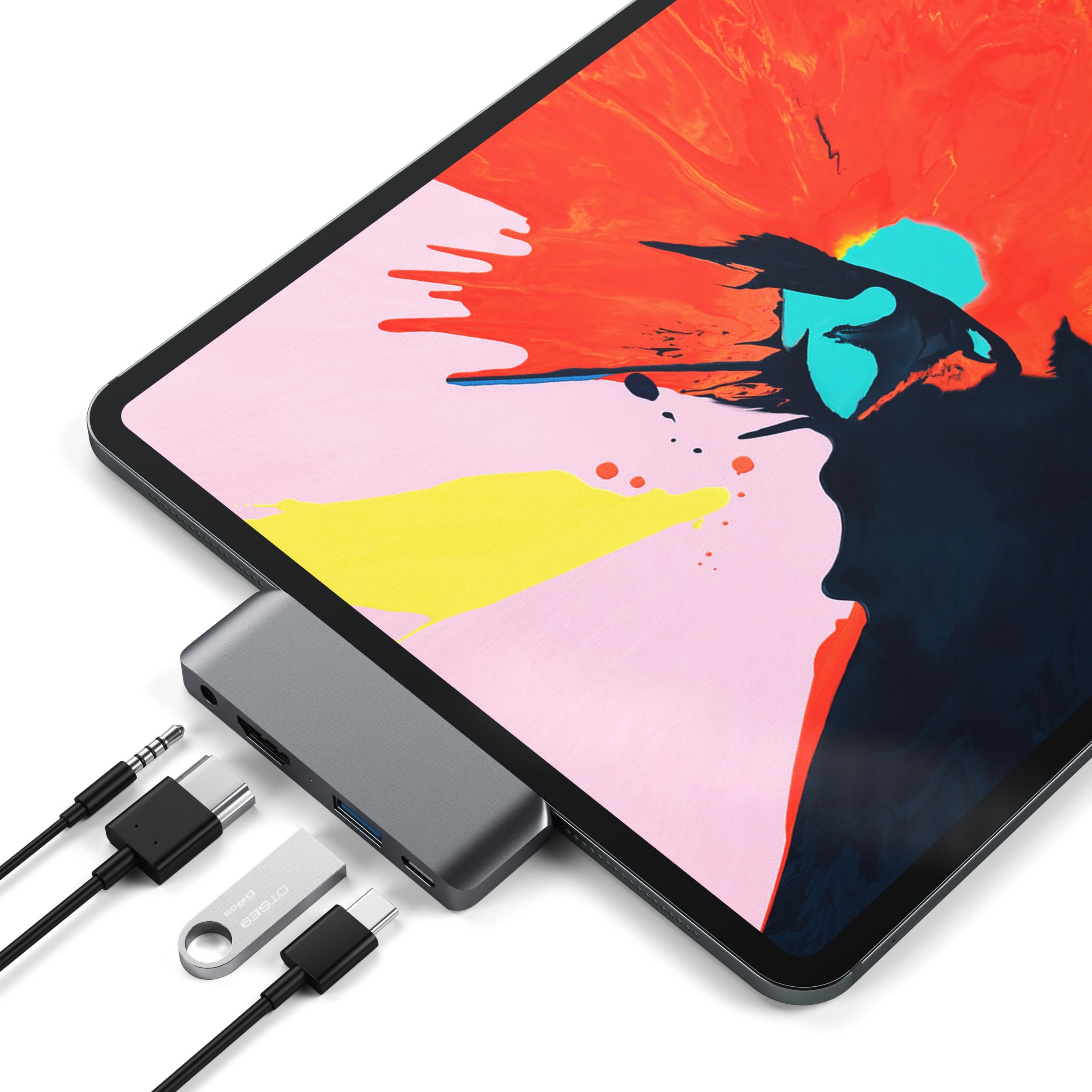 Tablet mit USB-C-Hub, USB-Stick und Audioanschluss. Bunter abstrakter Bildschirm.