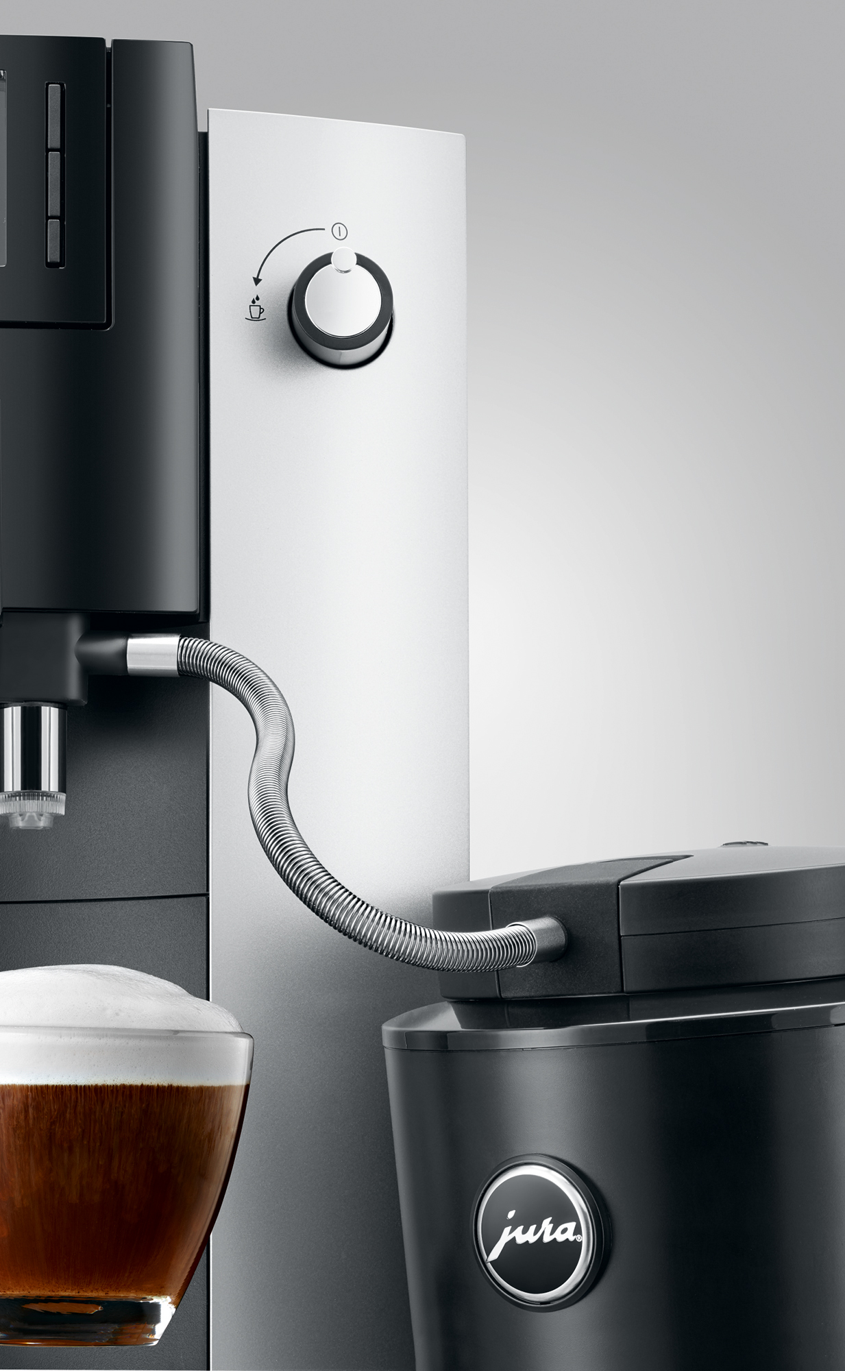 Coffee machine dispensing coffee into a glass.
