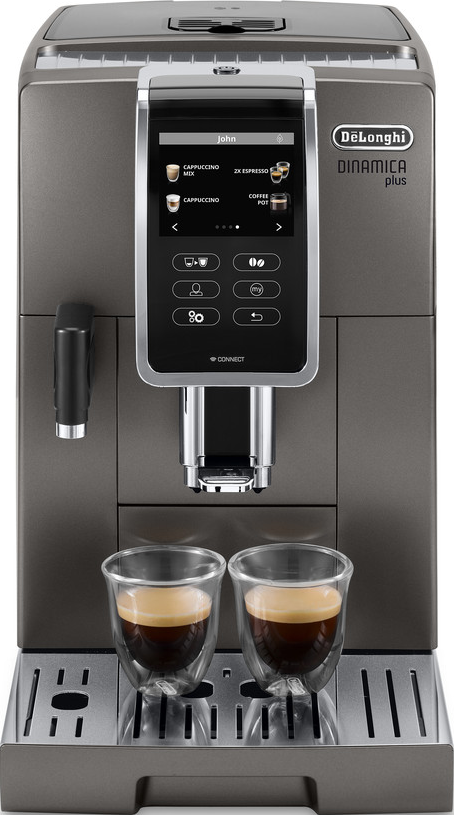 Eine graue Espressomaschine mit zwei Kaffeetassen davor.