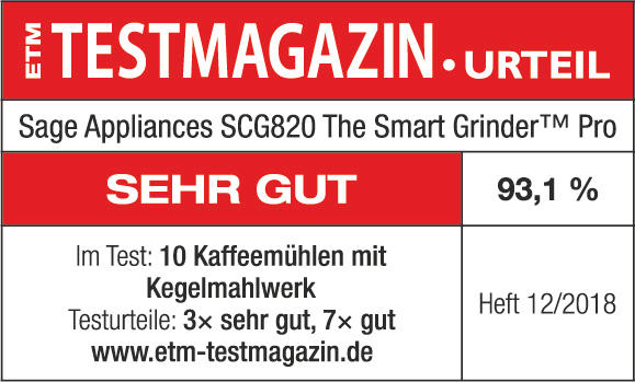Rotes und weißes Testmagazin mit Text über eine Kaffeemühle und der Note 93,1%.