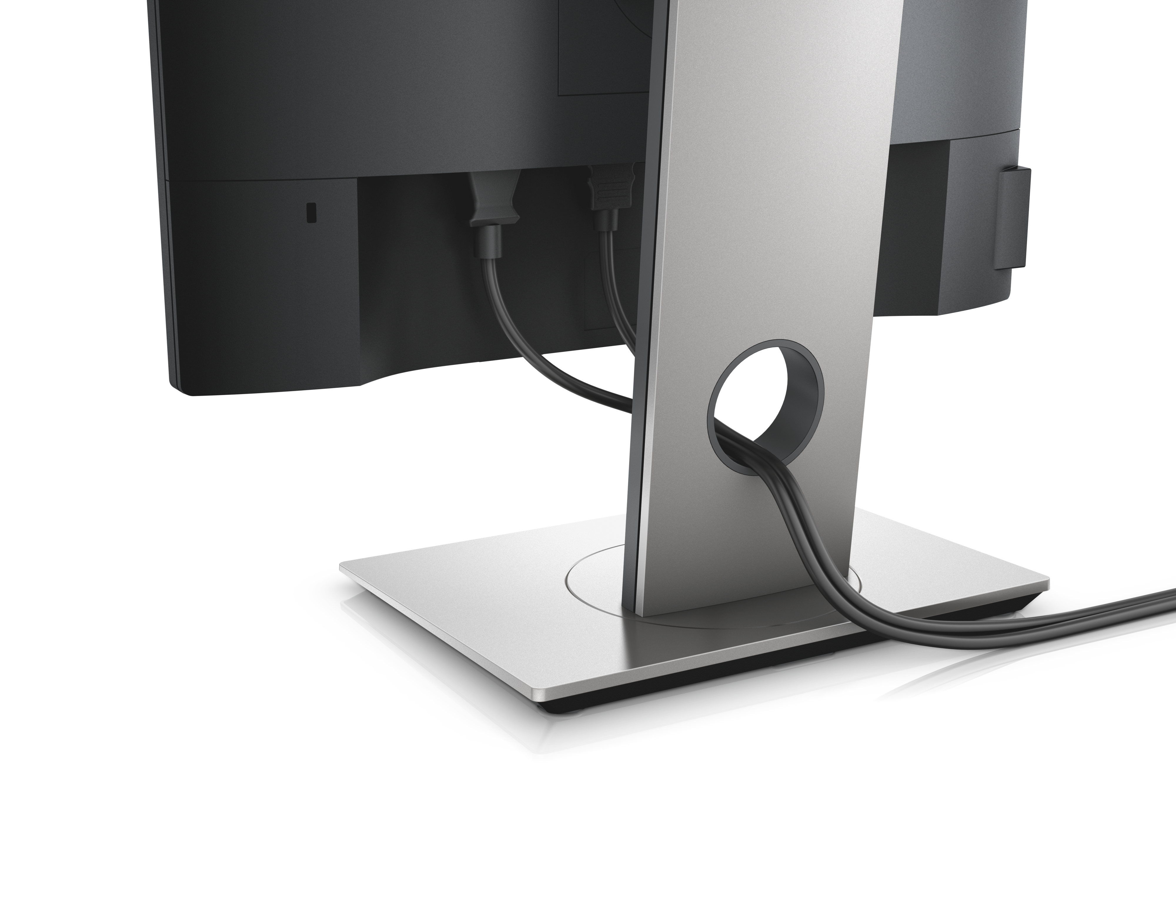 Rückseite des Monitors, Kabel und Ständer sind sichtbar. Schwarze Kabel verlaufen durch die silberne Rückseite des Ständers. Die Basis ist silbern.