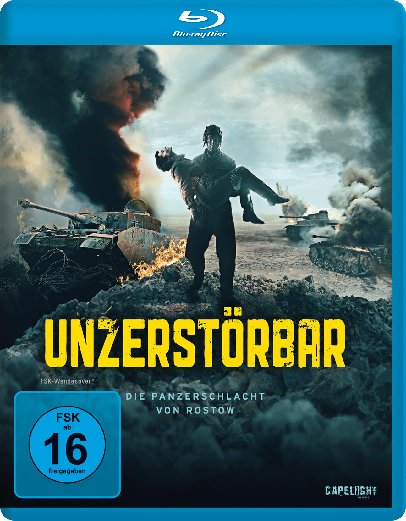 Blu-ray-Filmcover, 'Unzerstörbar', ein Mann trägt einen anderen Mann in einer Explosionsszene mit Panzern.