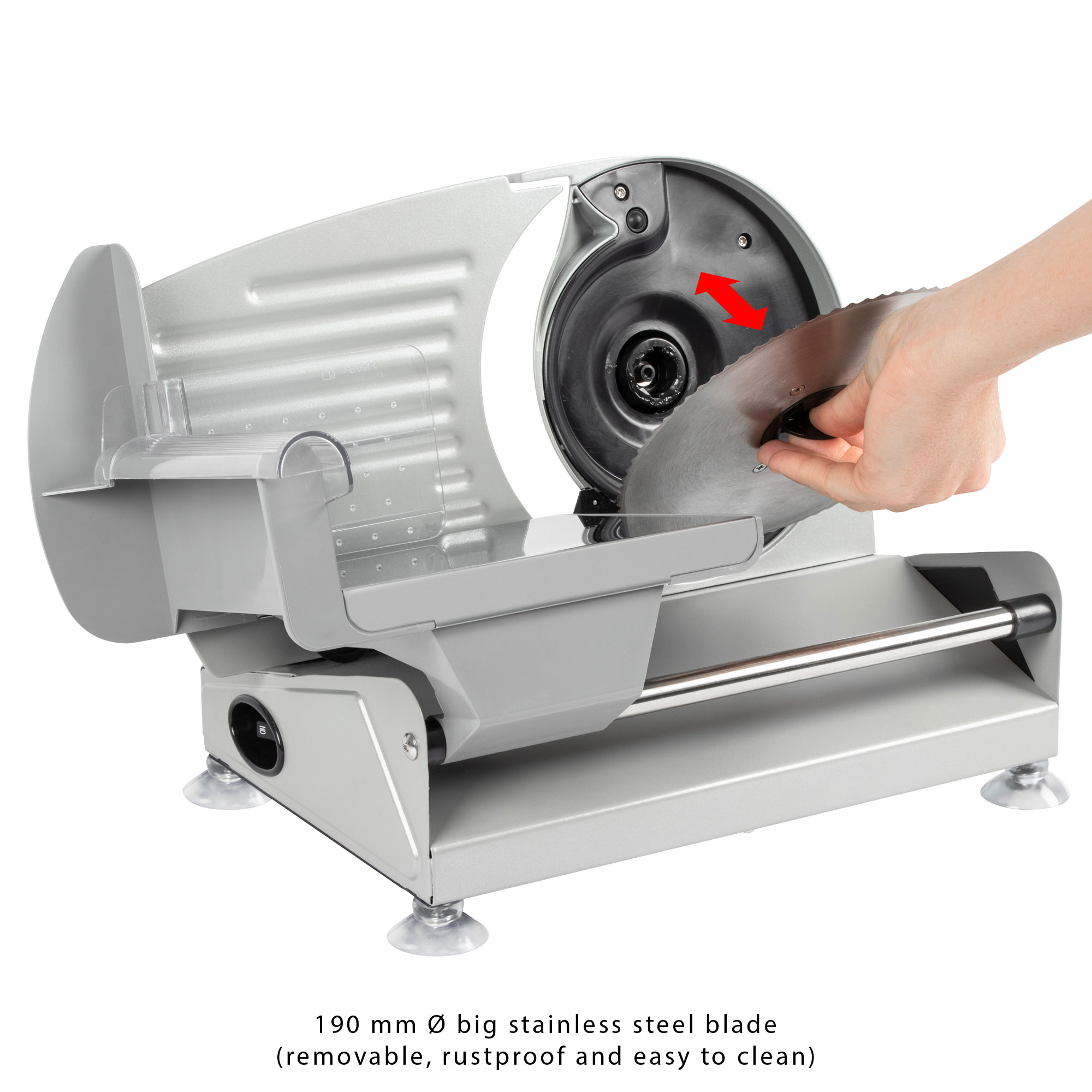 Silberne Fleischschneidemaschine mit Edelstahlklinge, eine Hand entfernt die Klinge.