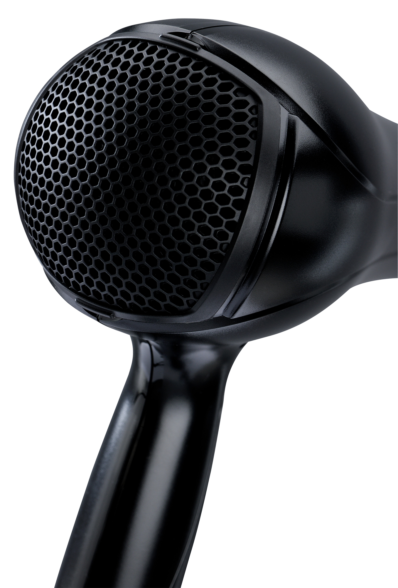 Close-up of a black hair dryer's nozzle with a honeycomb-patterned mesh.