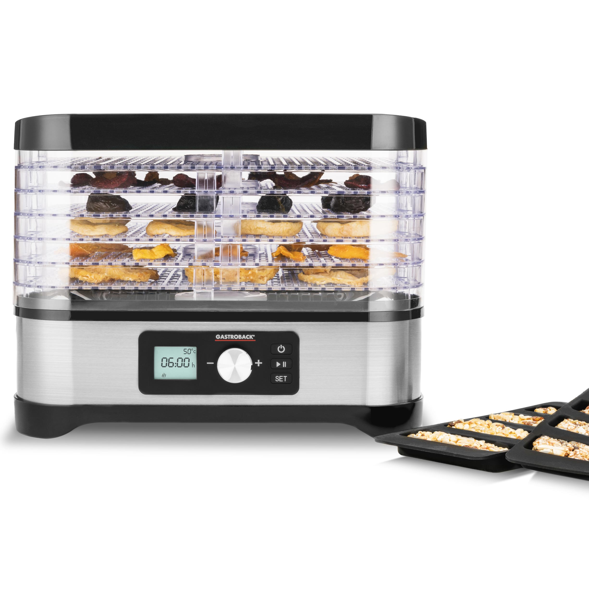 Lebensmittel-Dehydrator mit Tabletts, getrocknete Lebensmittel zeigend. Silber und Schwarz mit Digitalanzeige.