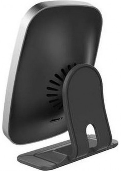 Vue arrière d'un appareil noir avec un bord argenté, sur un support noir. Il a un ventilateur.