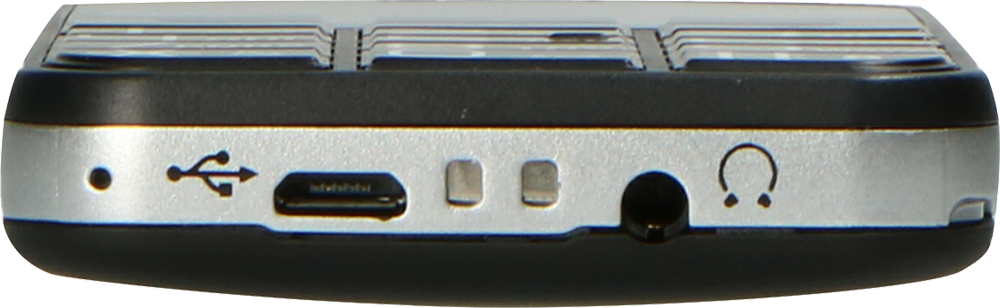 Close-up van de onderkant van een apparaat. USB, oplaadpoort en koptelefoonaansluiting zijn zichtbaar.