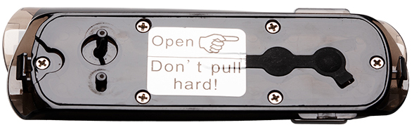 Black device with a sticker that says 'Open' and 'Don't pull hard!'. Screws are visible.