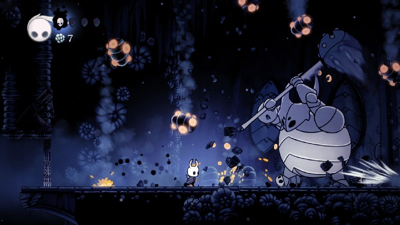 Captura de pantalla del juego. Personaje tipo caballero lucha contra un gran enemigo.